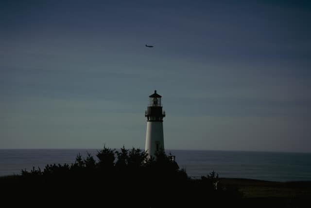 Lighthouse silhouette at dusk