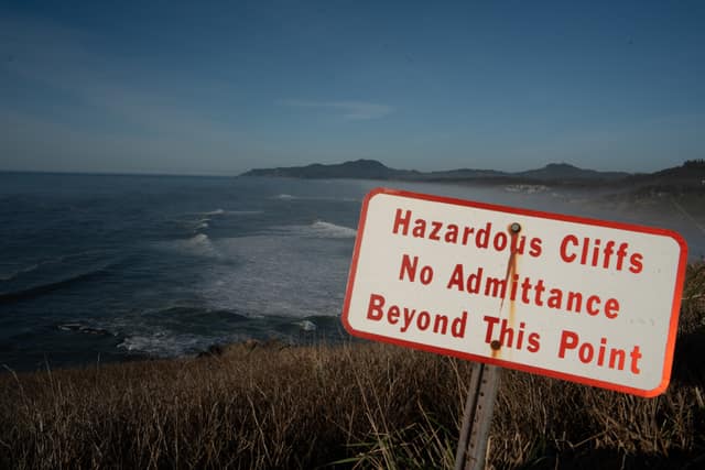 Hazard sign at the cliff's edge