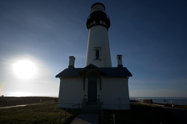 Yaquina Head Lighthouse backlit by a low winter sun