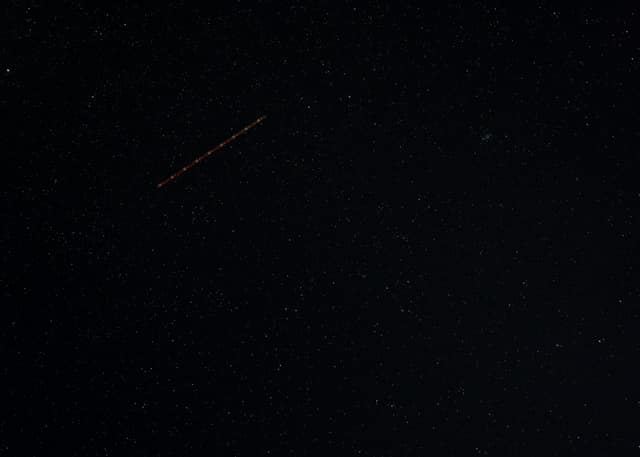 Faint stars in a near-black sky