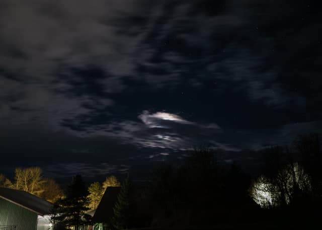 Moonlight breaking through night clouds