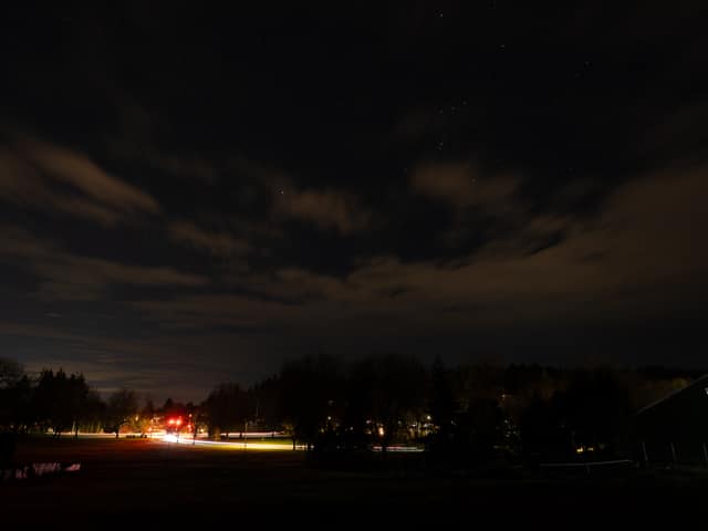 Runway lights burning under night cloud