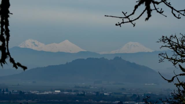 Snowy Cascade peaks floating over town