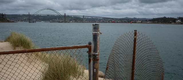 Fishing nets and a distant coastal bridge