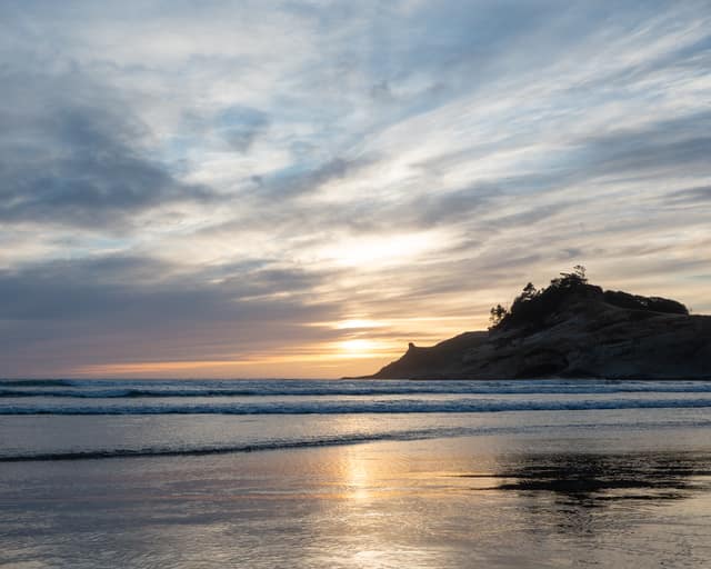 Wet beach reflecting the sunset