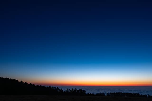 Dawn gradient over a sea of clouds