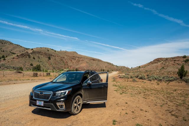 SUV parked on a remote dirt road
