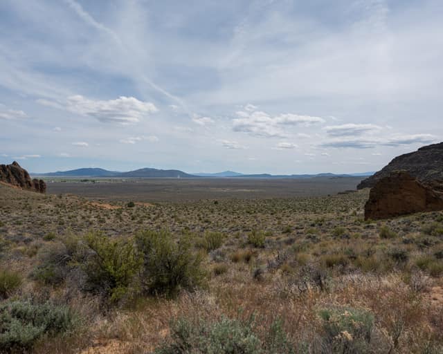 Open sage plain with distant buttes