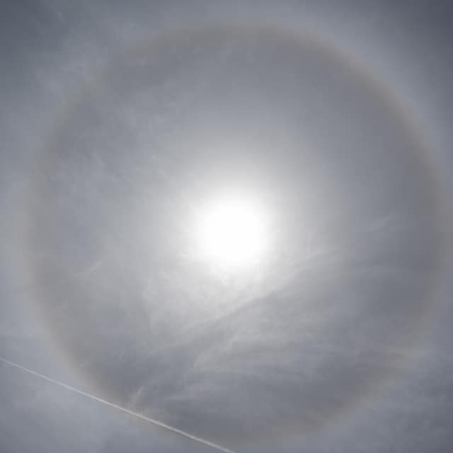 Halo ringing the sun, wide sky