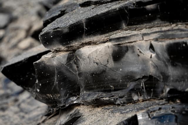 Obsidian glass catching the light, macro