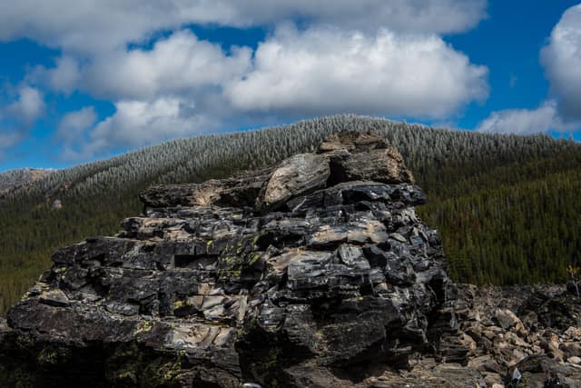 Rock cairn overlooking burned forest