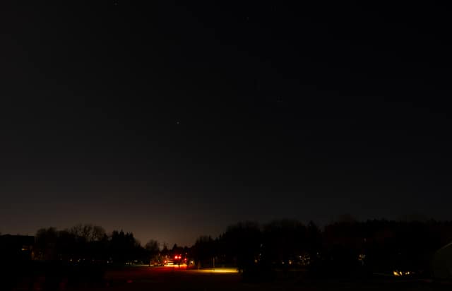 Distant lights under a starry night